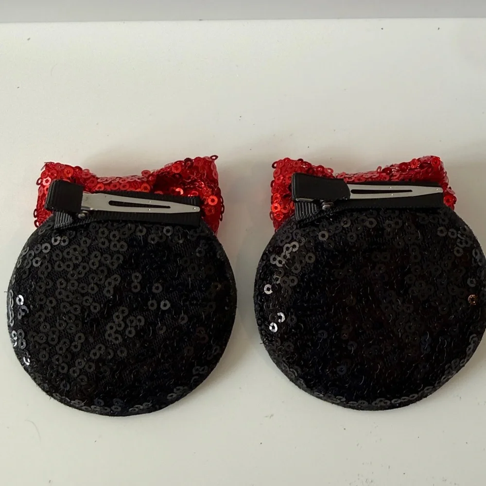 Black MinnieMouse Ear Hair Clips with Red Bows.